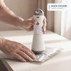 Hands using Pack & Press™ portable vacuum pump to compress clothes in a vacuum bag
