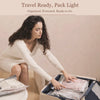 Pack & Press™ vacuum pump compressing clothes into travel bag for stress-free packing